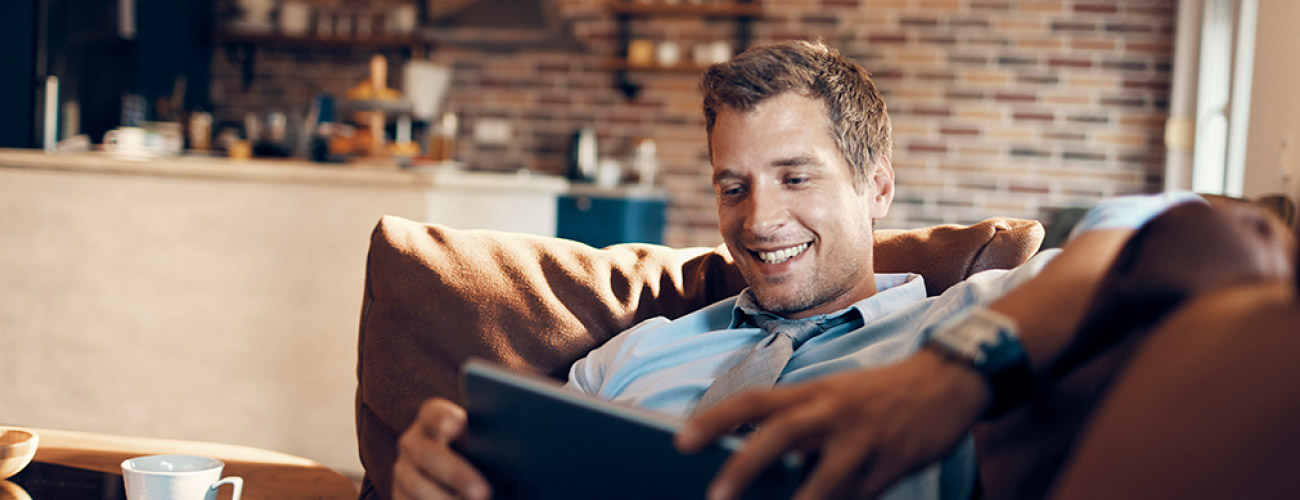 Man using tablet and smiling